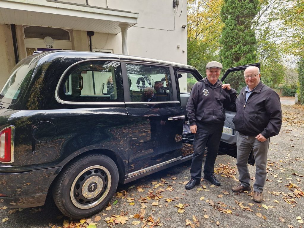 john_with_a_customer_outside_the_taxi