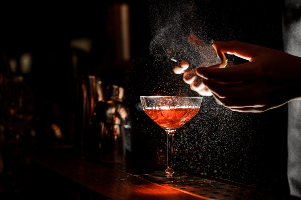 A bartender making a cocktail
